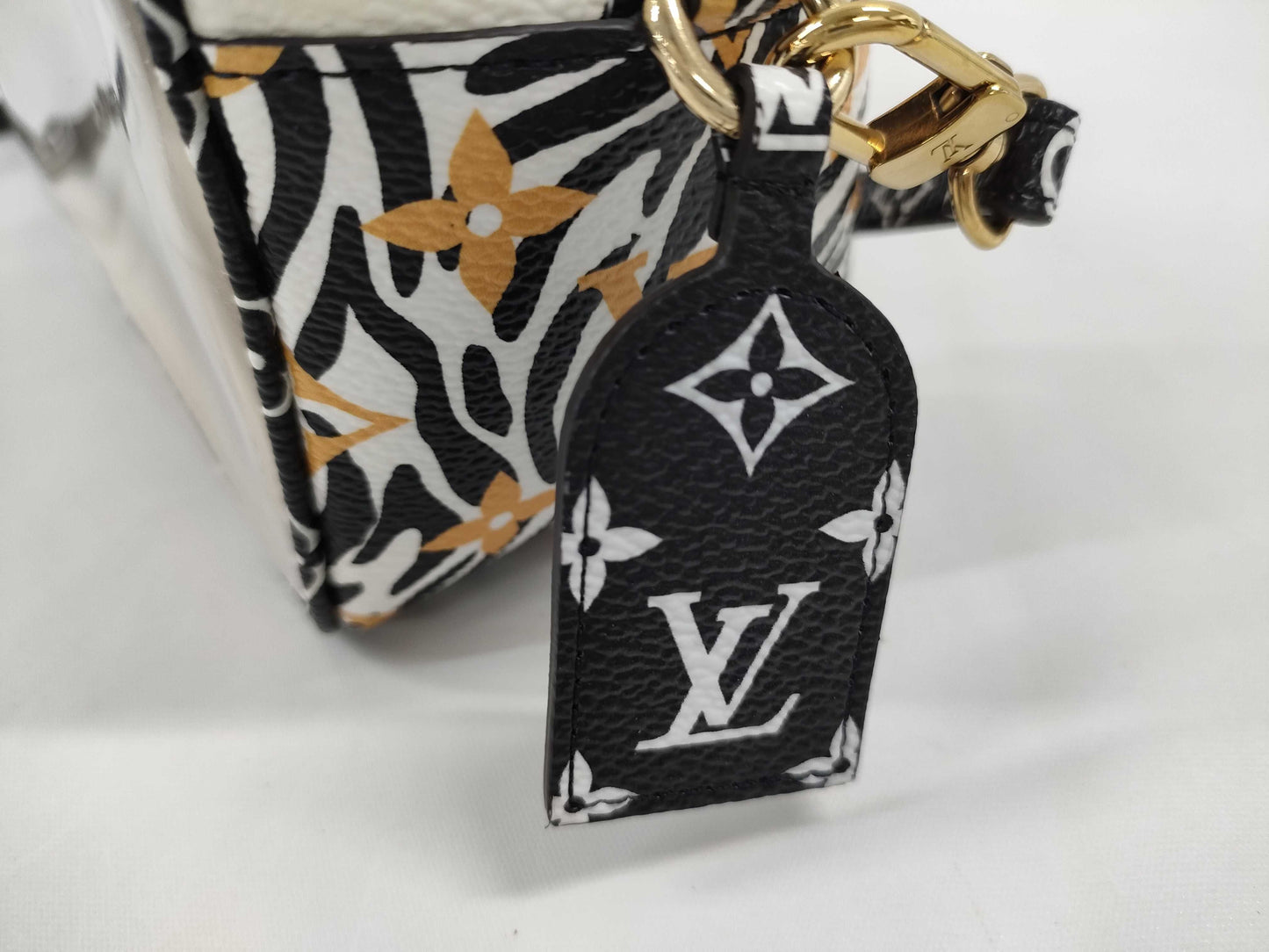 LOUIS VUITTON Jungle Beach Pouch Shoulder Bag in White with Multicolored and Gold Hardware, Monogram Canvas, M67883 TR2129 Shoulder Bag