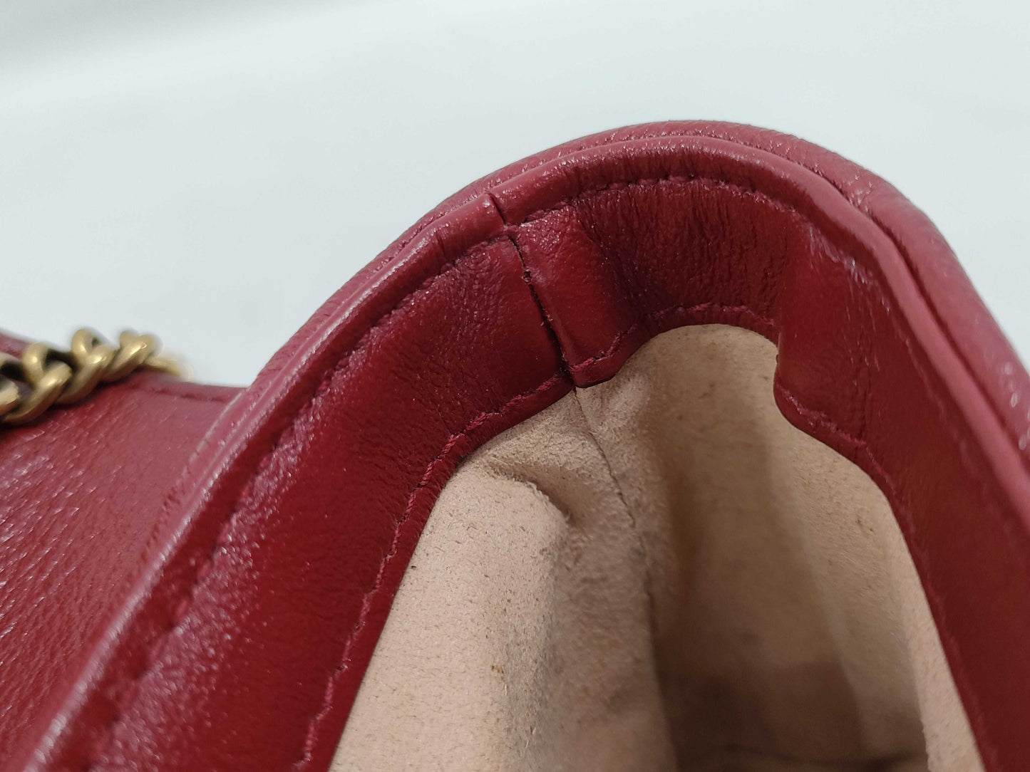 GUCCI Super Mini GG Marmont Matelasse Leather Shoulder Bag in Black, Red, and Gold Hardware with Chain Shoulder Strap