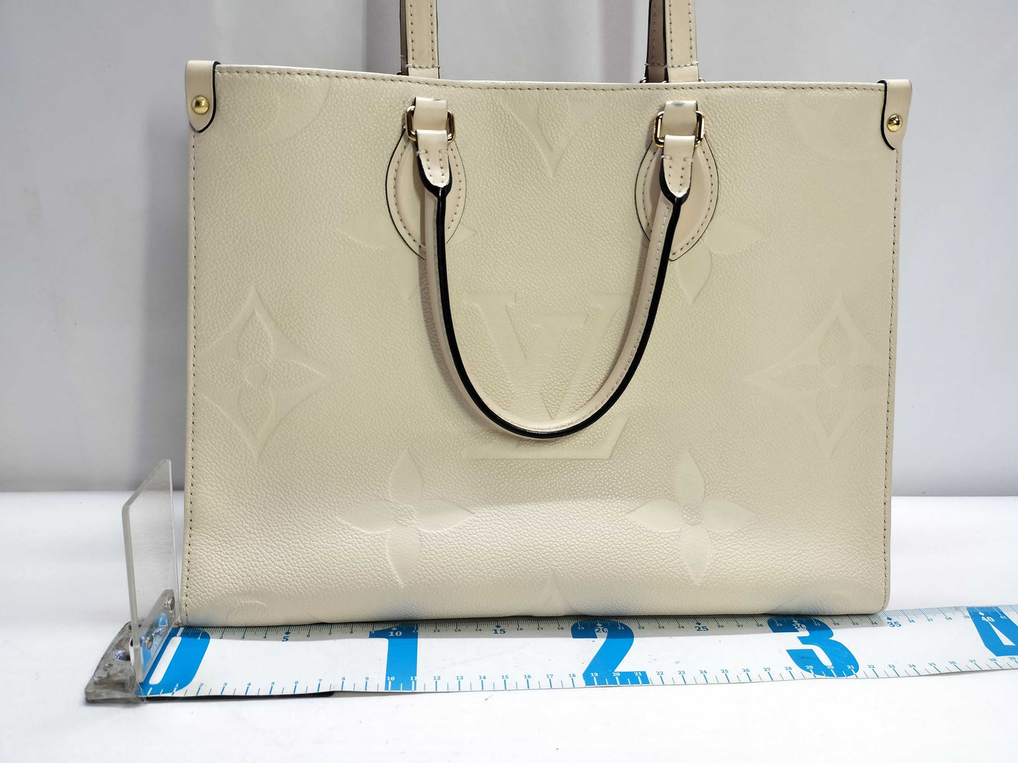 LOUIS VUITTON Monogram Empreinte Louis Vuitton On the Go MM Tote Bag