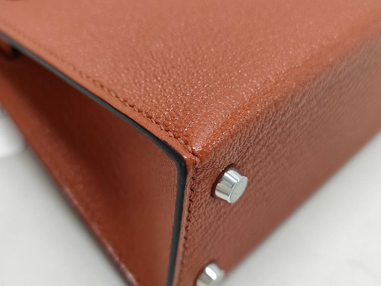 HERMES Kelly Mini II Cuivre Shoulder Bag with P hardware, Chevre U stamp, and protective seal