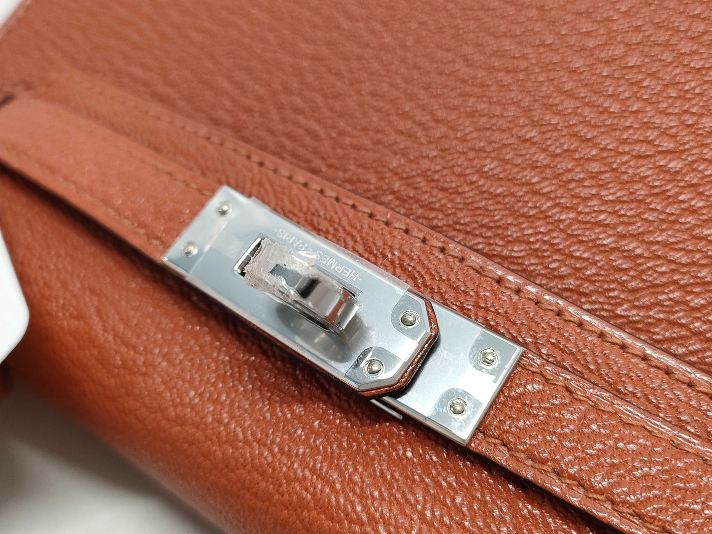 HERMES Kelly Mini II Cuivre Shoulder Bag with P hardware, Chevre U stamp, and protective seal