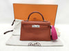 HERMES Kelly Mini II Cuivre Shoulder Bag with P hardware, Chevre U stamp, and protective seal