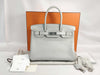 HERMES Birkin 30 handbag in ivory with silver hardware and a C stamp.