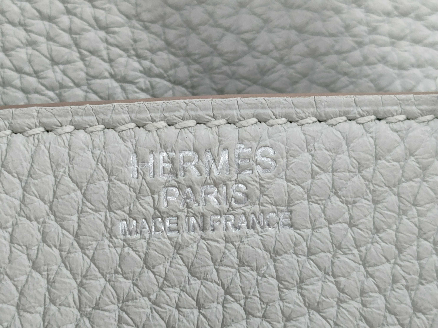 HERMES Birkin 30 handbag in ivory with silver hardware and a C stamp.