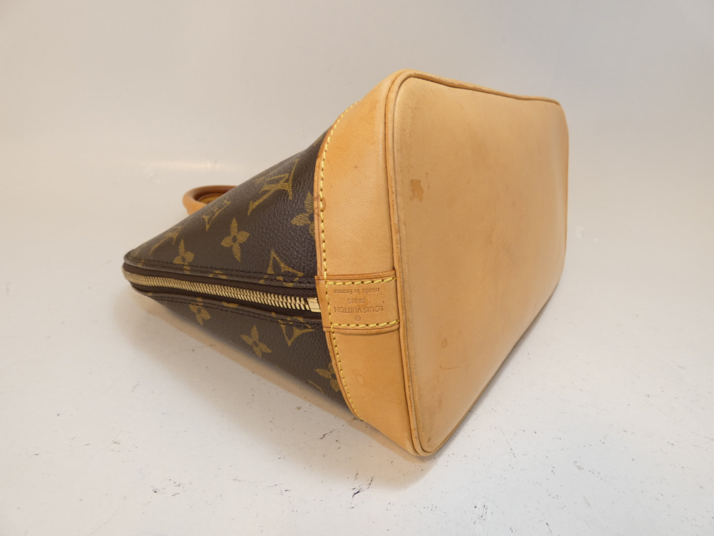 LOUIS VUITTON Alma Monogram Handbag