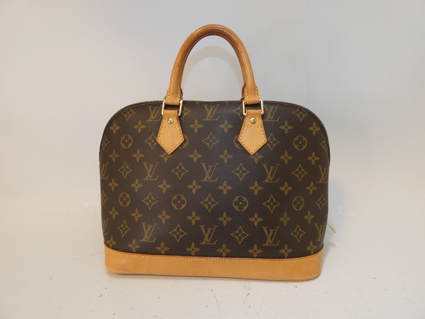 LOUIS VUITTON Alma Monogram Handbag