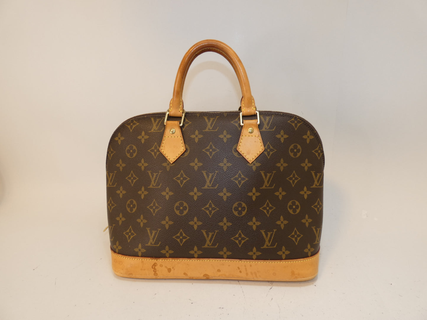 LOUIS VUITTON Alma Monogram Handbag