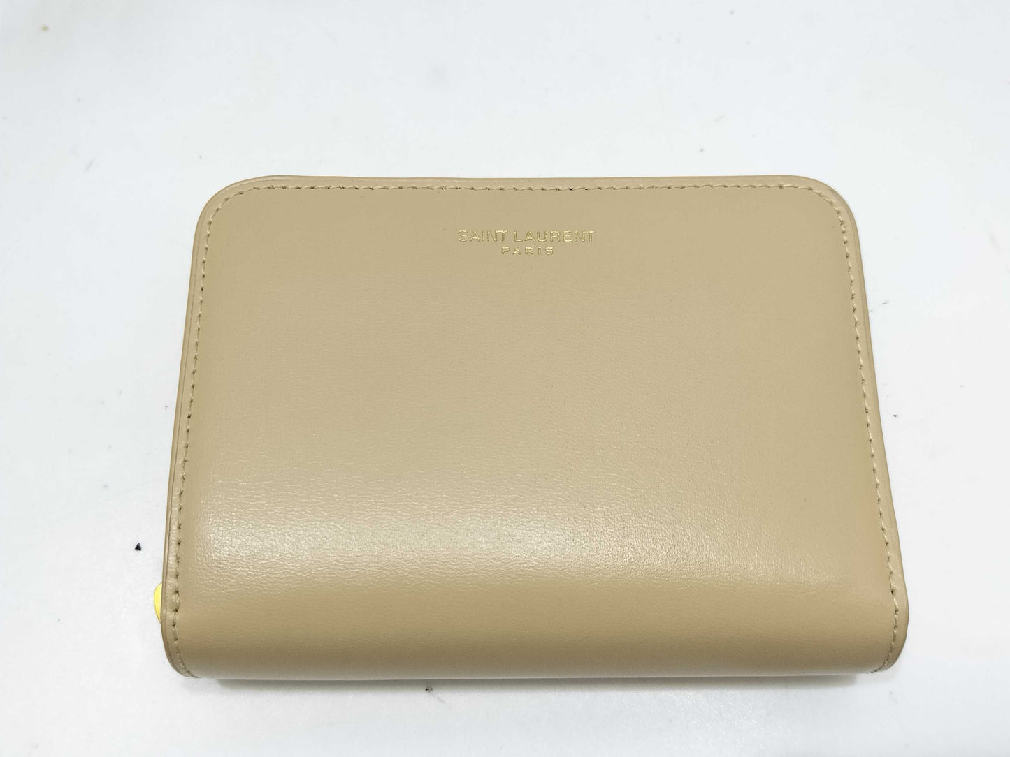 Yves Saint Laurent Paris Logo Bifold Wallet in Beige Leather
