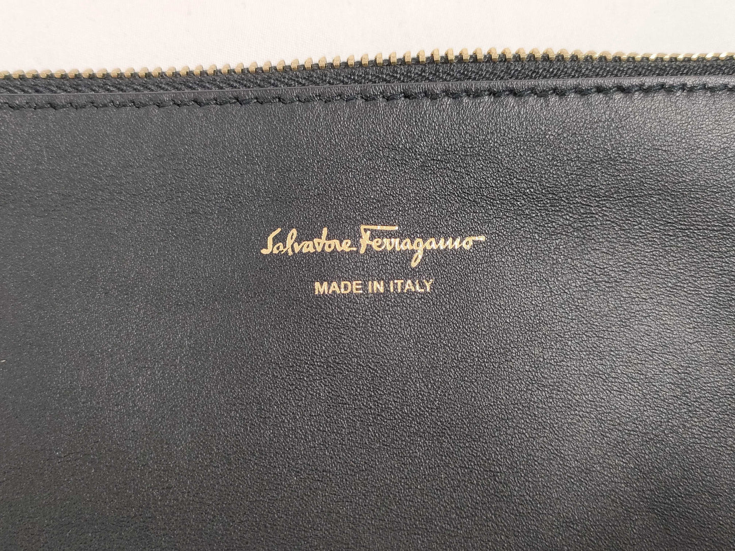Salvatore Ferragamo black pouch with case