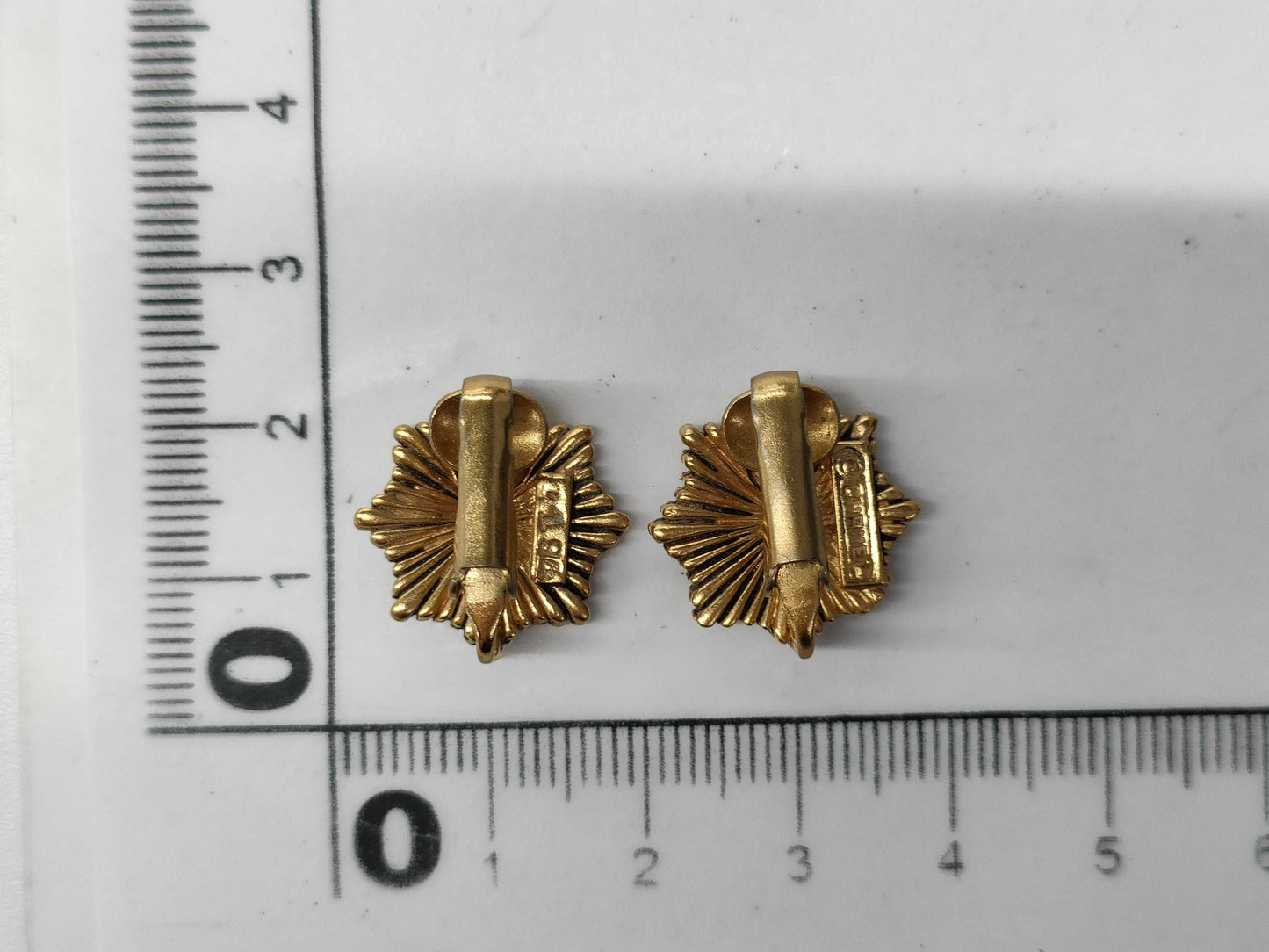 CHANEL engraved Coco Mark medal motif earrings