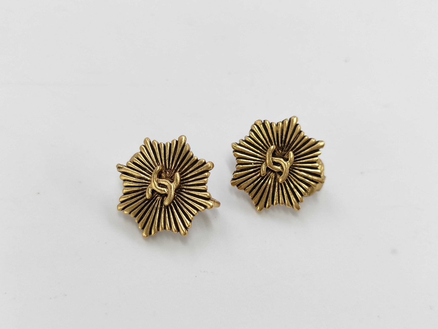 CHANEL engraved Coco Mark medal motif earrings