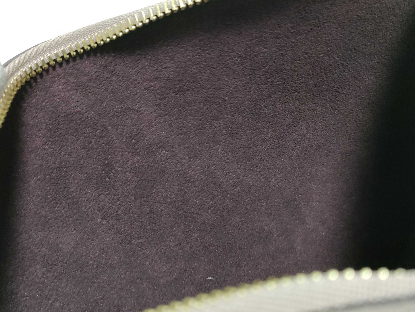 LOUIS VUITTON RFID verification impossible. Serial number verification impossible. Monogram Empreinte Louis Vuitton Neverfull Pouch in Taupe with Gold Hardware.