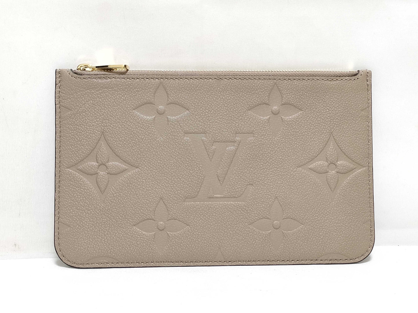 LOUIS VUITTON RFID verification impossible. Serial number verification impossible. Monogram Empreinte Louis Vuitton Neverfull Pouch in Taupe with Gold Hardware.