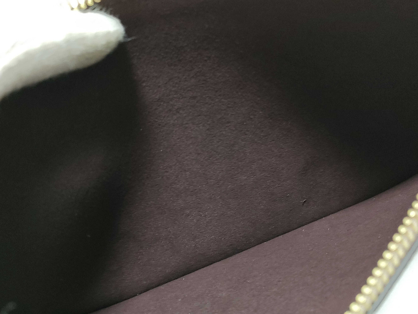 LOUIS VUITTON RFID verification impossible. Serial number verification impossible. Monogram Empreinte Louis Vuitton Neverfull Pouch in Taupe with Gold Hardware.
