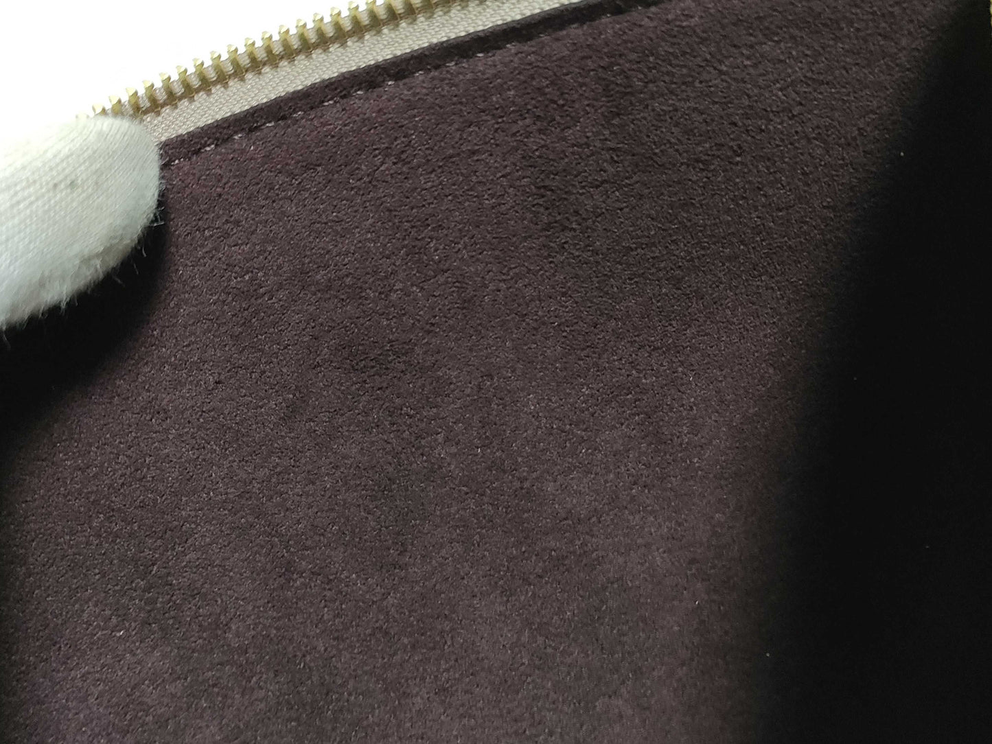 LOUIS VUITTON RFID verification impossible. Serial number verification impossible. Monogram Empreinte Louis Vuitton Neverfull Pouch in Taupe with Gold Hardware.