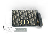 Dior Oblique 2-way waist pouch in navy, beige, and gold hardware. Canvas and leather shoulder bag.