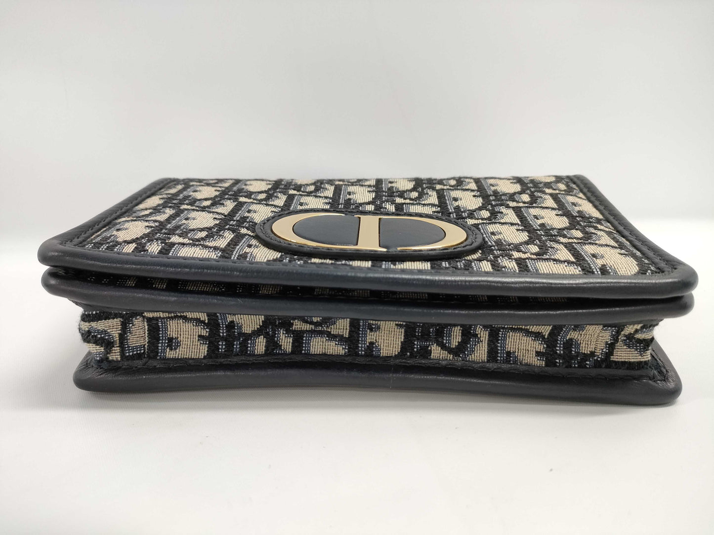 Dior Oblique 2-way waist pouch in navy, beige, and gold hardware. Canvas and leather shoulder bag.