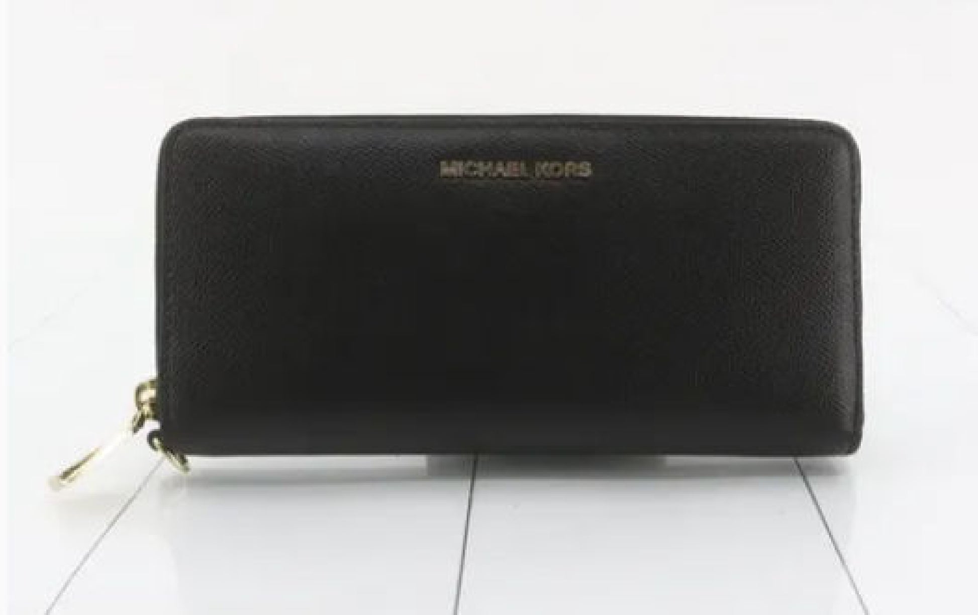 Michael Kors long wallet with round zipper