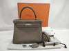 HERMES Kelly 25 Togo Etoupe Handbag with Silver Hardware, Inner Stitching, and K Stamp
