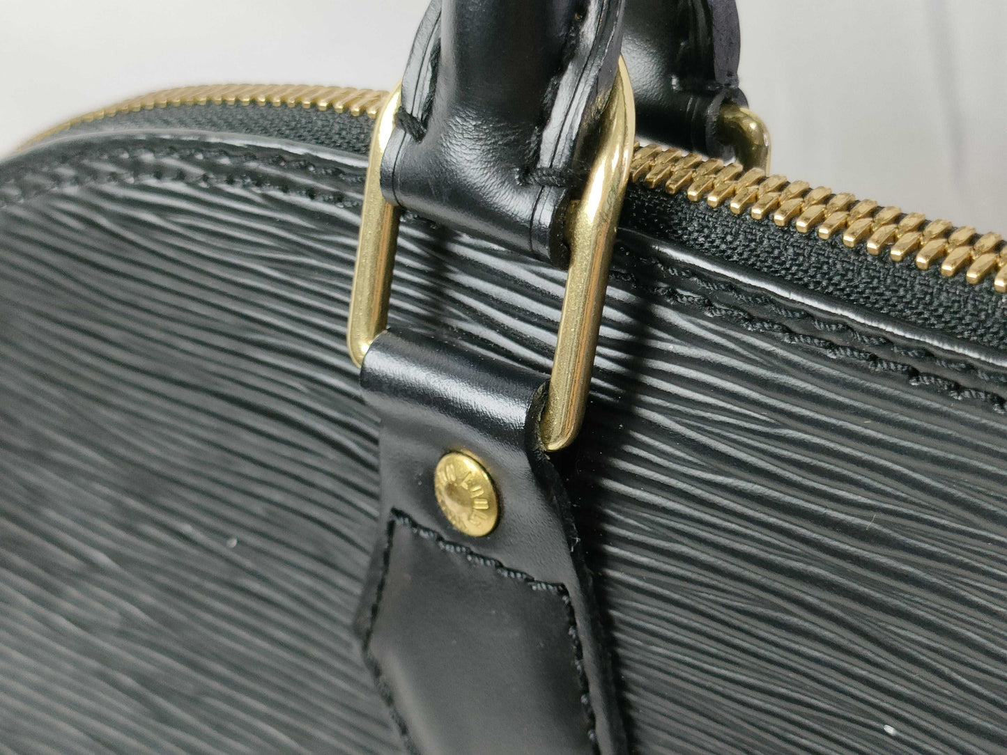 LOUIS VUITTON Epi Alma Noir Handbag