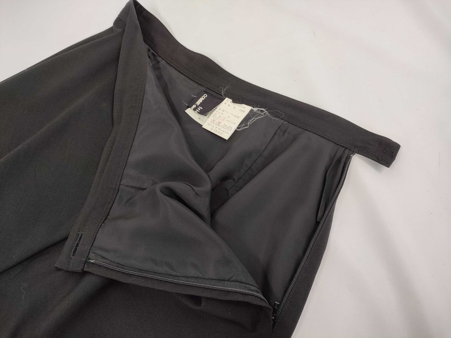 COMME des GARCONS toricot COMME des GARCONS early archive deformed wool tight skirt in black, size M