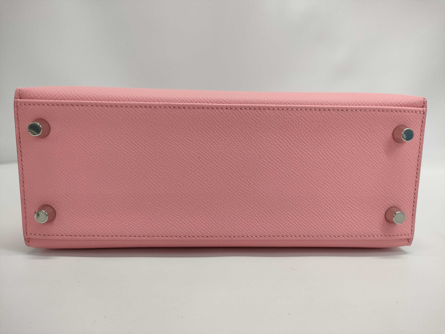 HERMES Kelly 25 handbag with rose confetti on the outside, Epson logo, silver hardware, K stamp.
