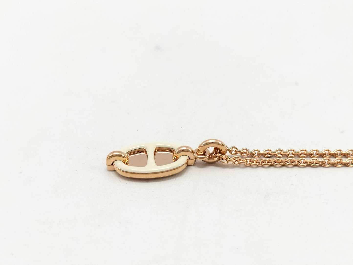 HERMES Mini Maillon pendant in cream with pink gold hardware. Necklace