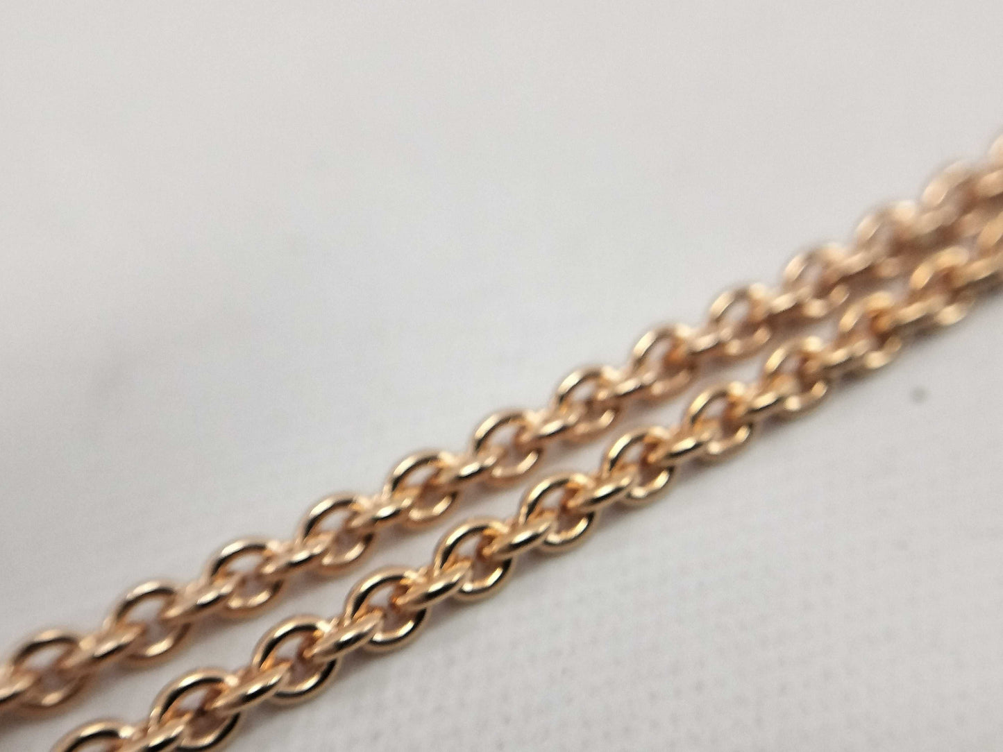 HERMES Mini Maillon pendant in cream with pink gold hardware. Necklace