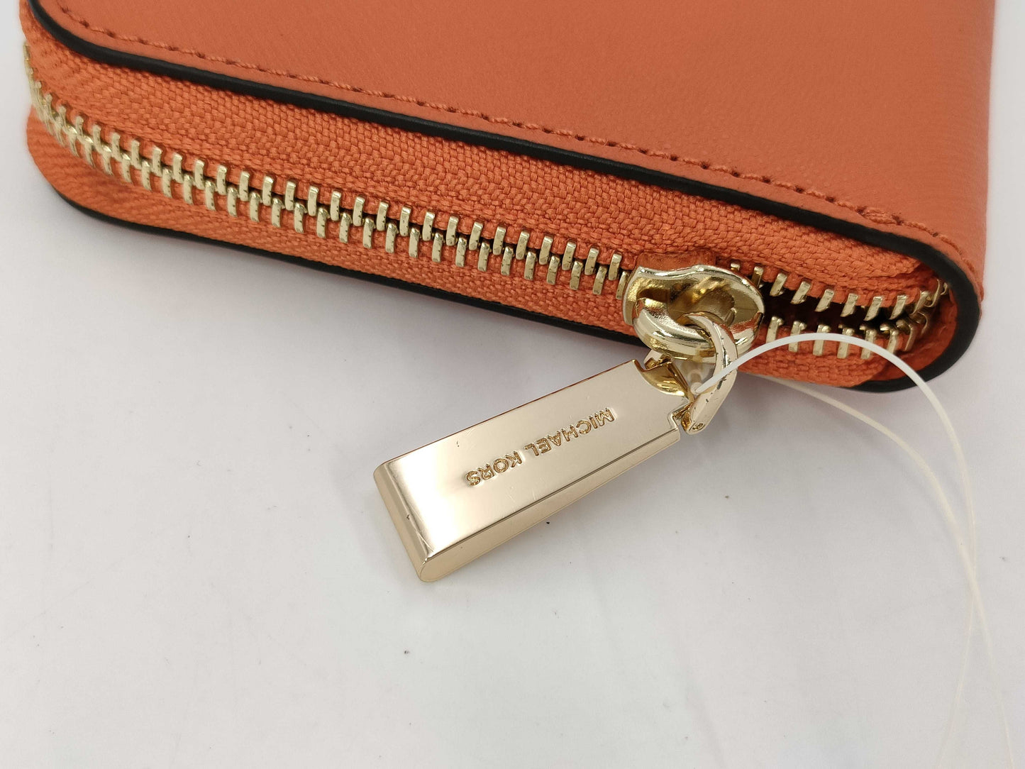 Michael Kors long wallet with round zipper, orange