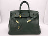 Green handbag with padlock, key and clochette