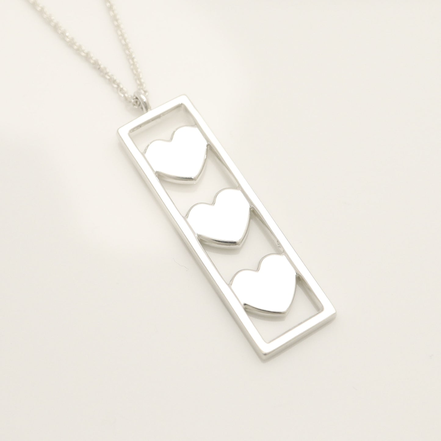 Tiffany & Co. Triple Heart Plate Necklace Pendant in Sterling Silver Weight: 2.58g