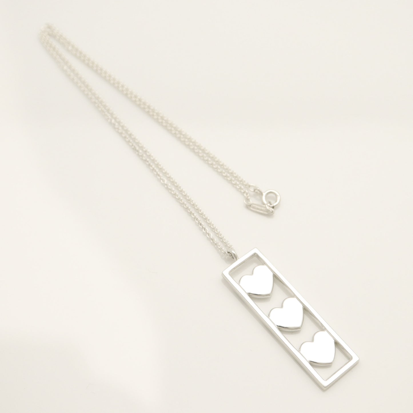 Tiffany & Co. Triple Heart Plate Necklace Pendant in Sterling Silver Weight: 2.58g