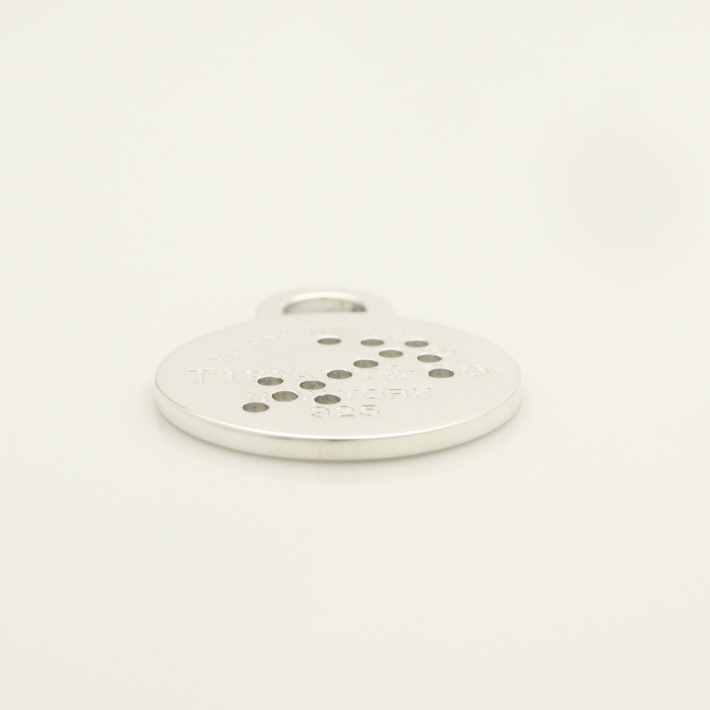 Tiffany & Co. Return to Tiffany Round Tag Arrow Punching Sagittarius Charm, 925 Sterling Silver, 8.20g