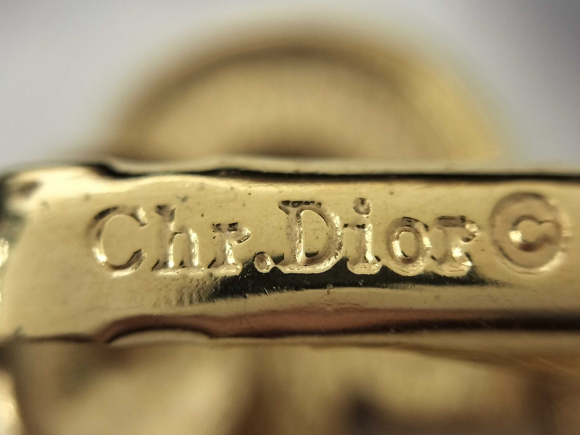 Dior Christian Dior CD logo earrings with rhinestones in gold.