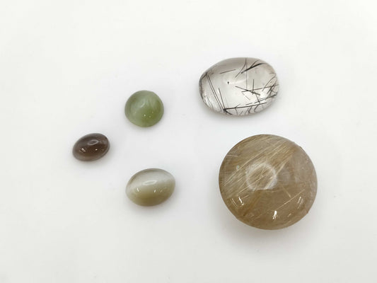 Rutile Quartz 44.824ct Nephrite Cat's Eye 4.89ct Quartz Cat's Eye 5.85ct Sirima Night Cat's Eye 3.33ct Rutilated Quartz 24.95ct Colored Stone / Loose