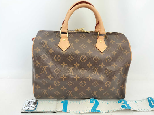 LOUIS VUITTON Monogram Louis Vuitton Speedy Bandouliere 30 Handbag