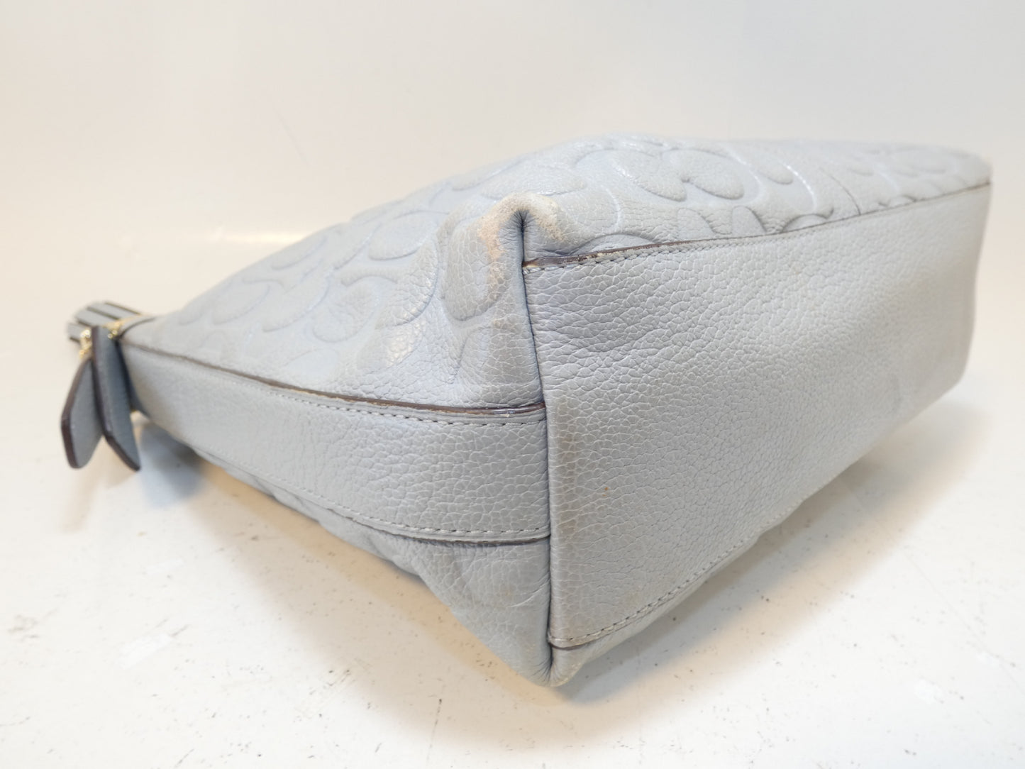 COACH Signature Embossed Leather Tassel Shoulder Bag