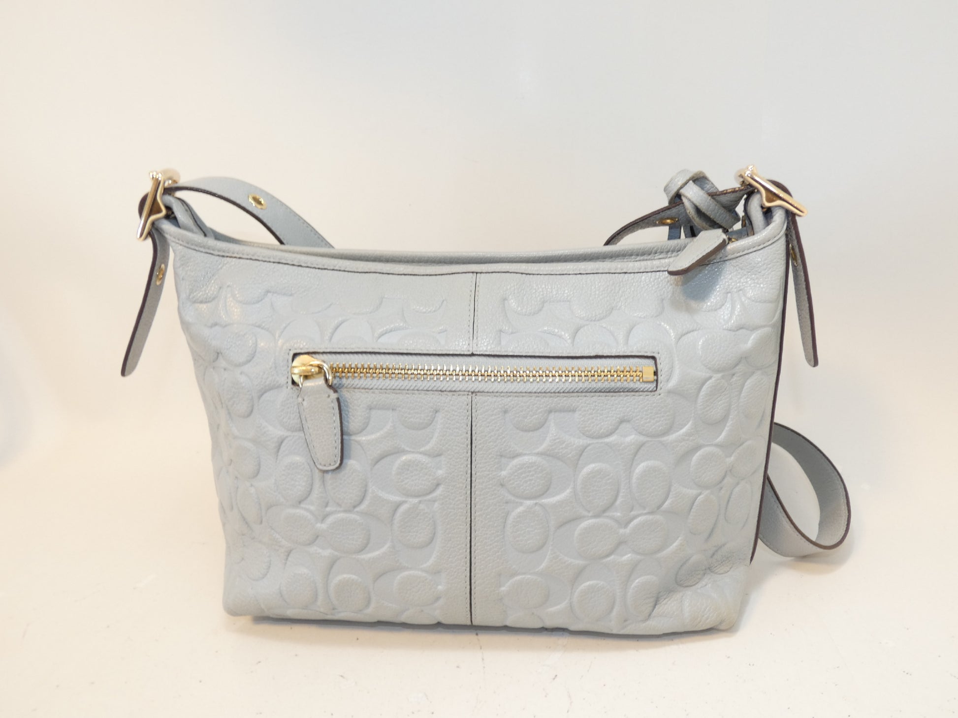 COACH Signature Embossed Leather Tassel Shoulder Bag