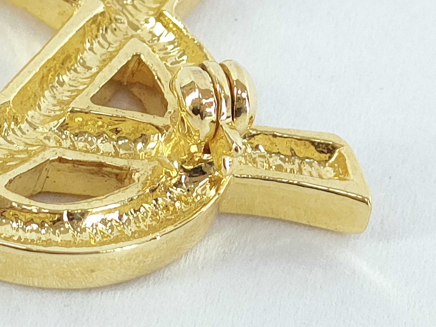 Yves Saint Laurent logo brooch