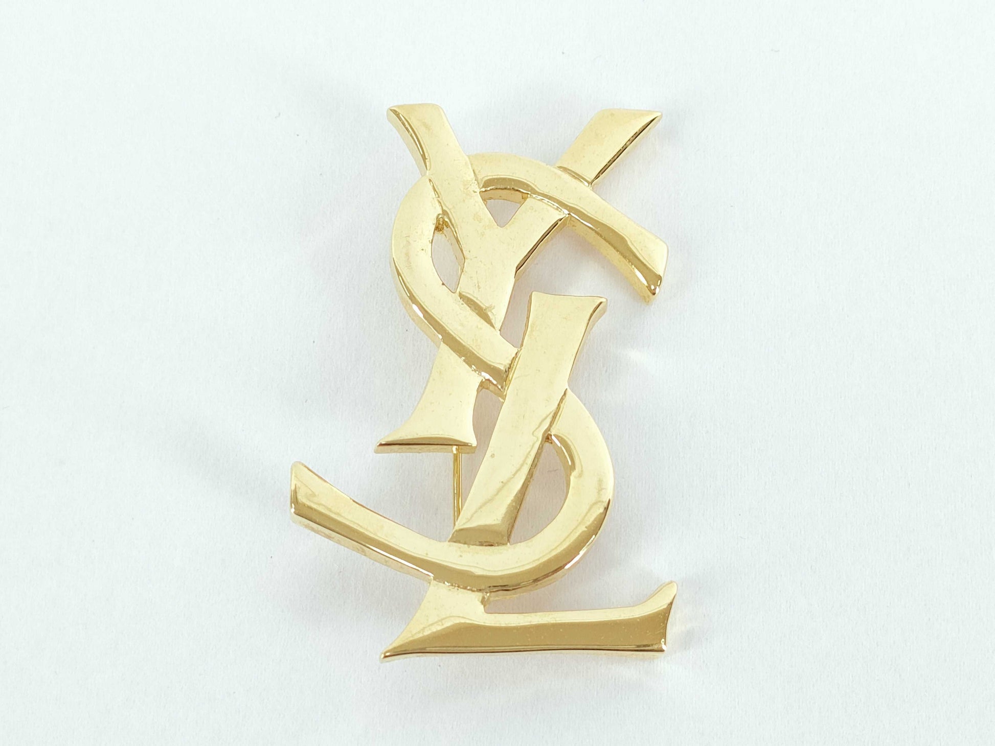Yves Saint Laurent logo brooch
