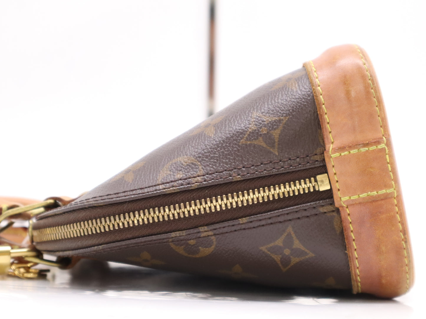 LOUIS VUITTON M53152 Monogram Alma BB Handbag with dust bag, box, padlock, two keys, and clochette