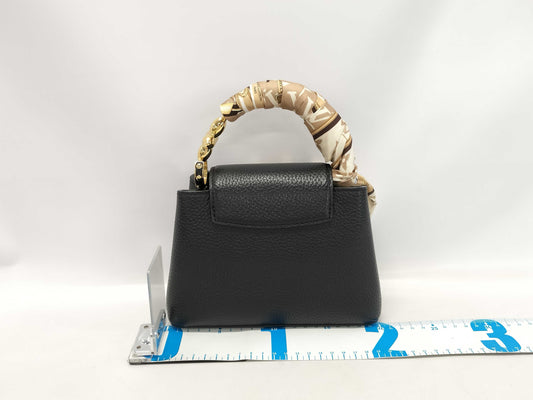 LOUIS VUITTON M23943 Taurillon Leather Capucines Mini Noir Handbag, RFID Enabled, No Serial Tag, Includes Strap, Scarf, Box, and Dust Bag