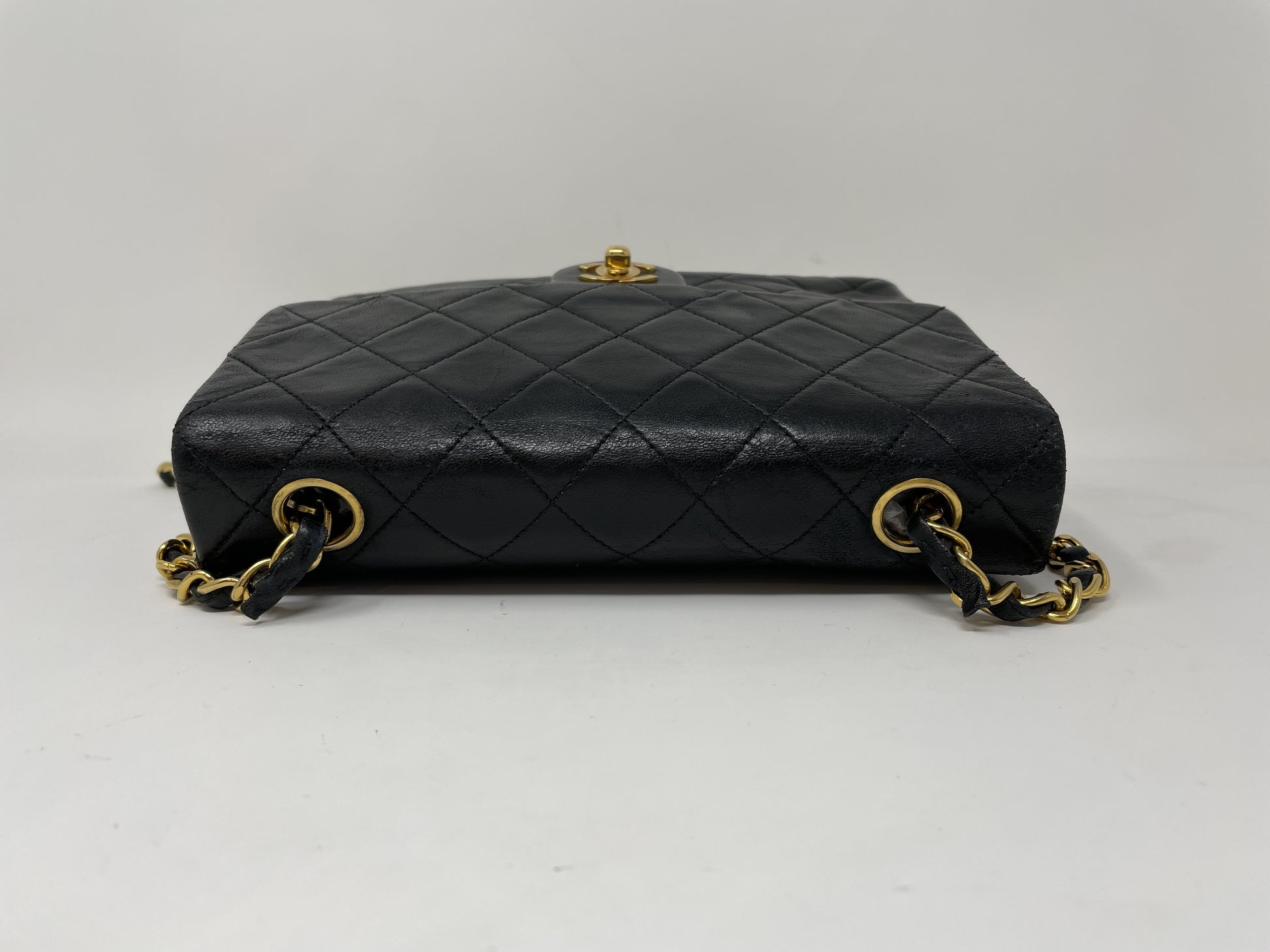 CHANEL CHANEL Mini Matelasse Shoulder Bag with Gold Hardware, Lambskin Coco Mark, and Turn Lock.