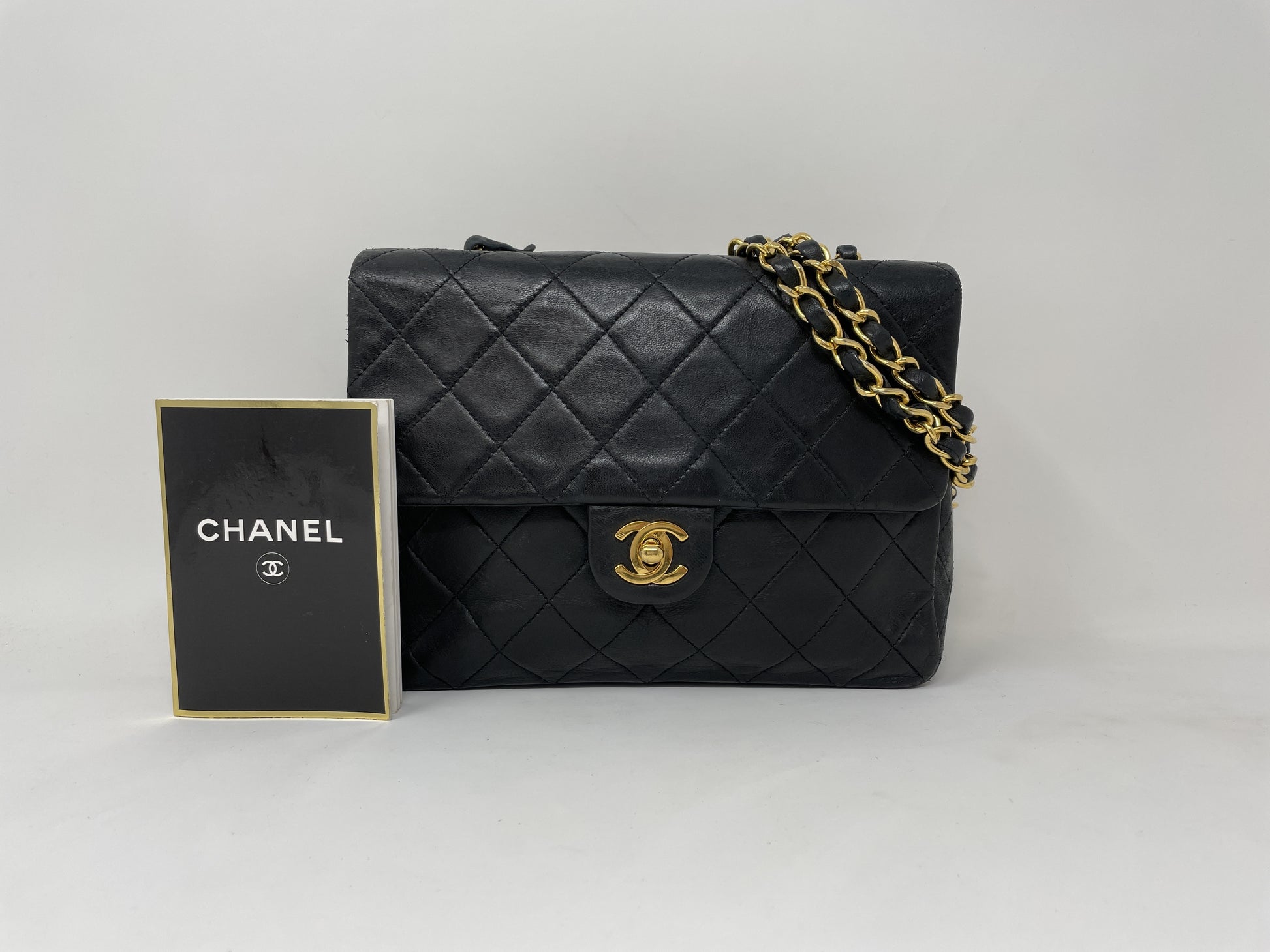 CHANEL CHANEL Mini Matelasse Shoulder Bag with Gold Hardware, Lambskin Coco Mark, and Turn Lock.