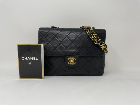 CHANEL CHANEL Mini Matelasse Shoulder Bag with Gold Hardware, Lambskin Coco Mark, and Turn Lock.