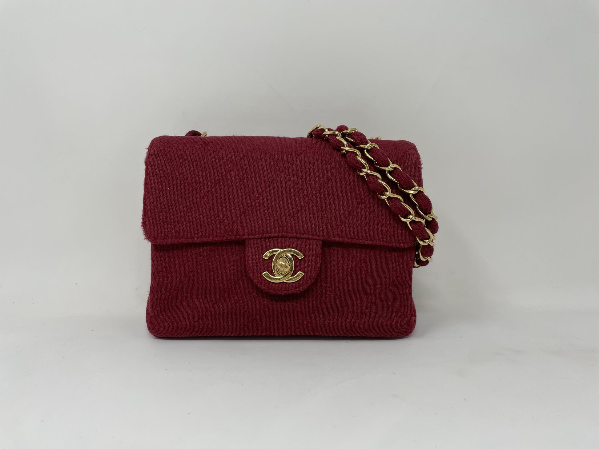 CHANEL CHANEL Mini Matelasse Shoulder Bag with Turn Lock, Gold Hardware, and Coco Mark
