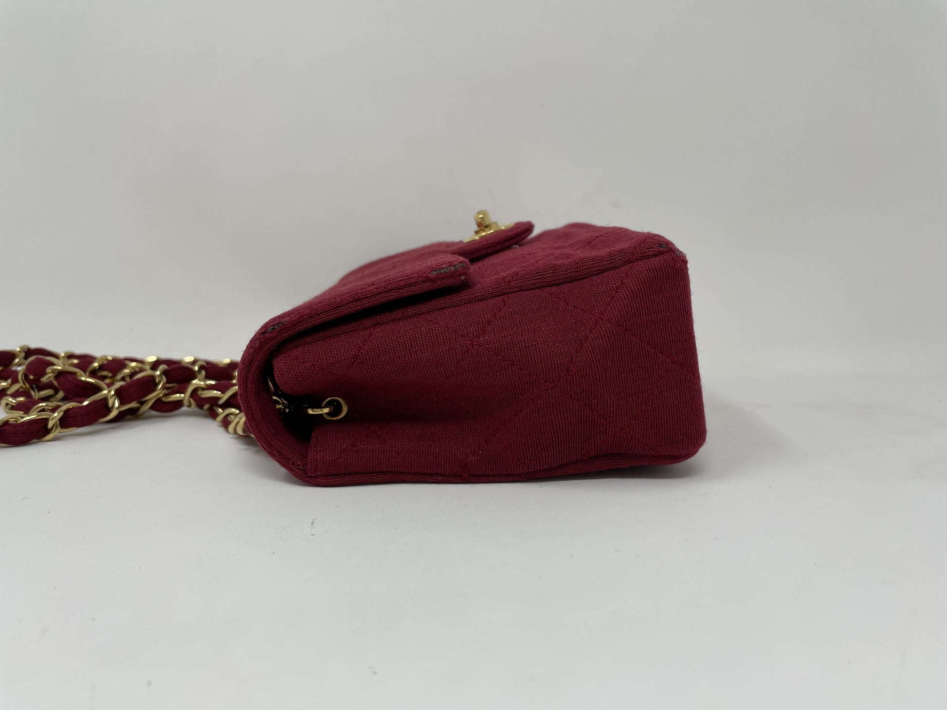 CHANEL CHANEL Mini Matelasse Shoulder Bag with Turn Lock, Gold Hardware, and Coco Mark