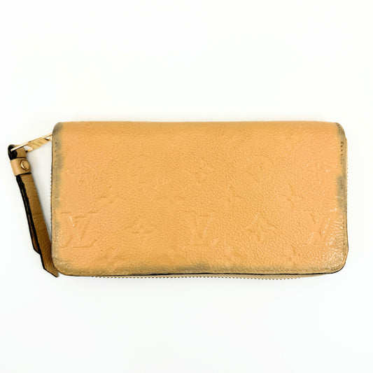 LOUIS VUITTON Monogram Empreinte Zippy Wallet, Beige, M61866.