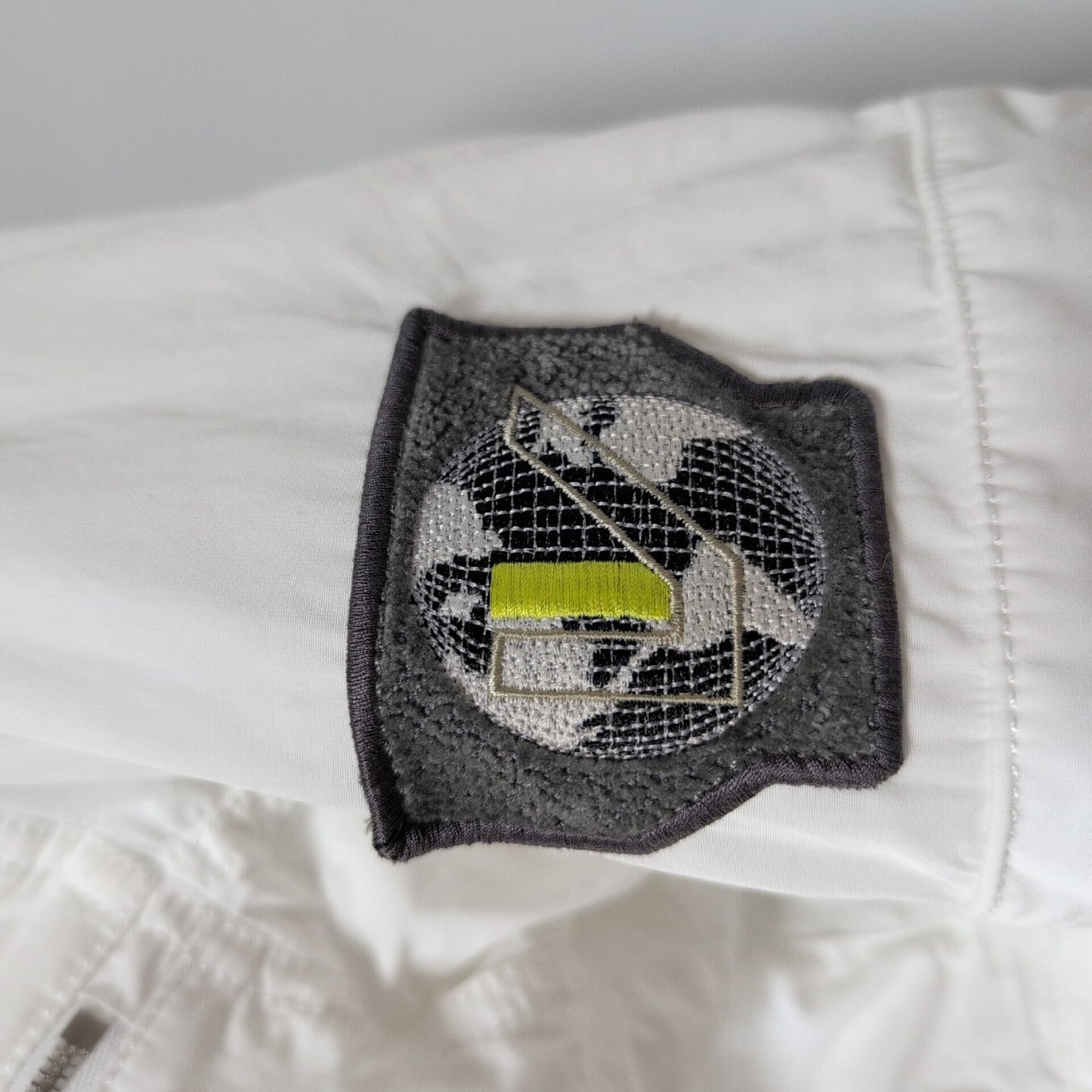 LOUIS VUITTON Excellent condition white zip-up jacket with LV logo patch.