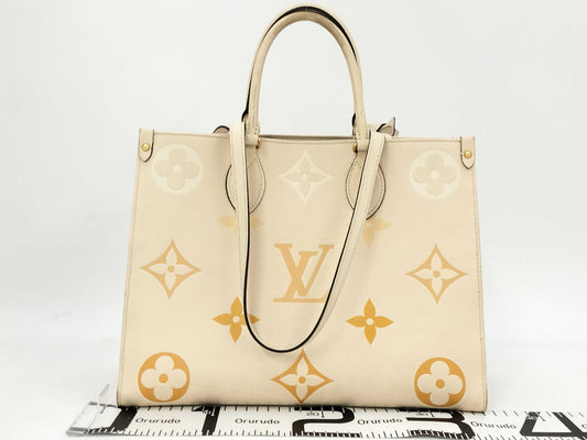 LOUIS VUITTON M45717 Monogram Empreinte On the Go MM Crème Saffron RFID Verified Tote Bag
